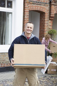 Removal team using safe handling practices during a house move