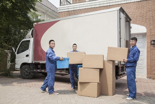 Professional movers handling furniture in Kensington