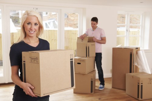 Removal team preparing a Kensington home move with packed boxes and furniture