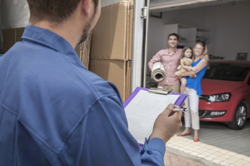 Removal team navigating a Kensington street during a same day move