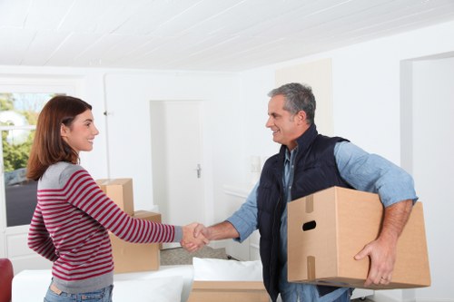 Kensington man and van service transporting furniture through a residential street
