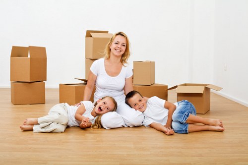 Professional mover transporting household items in Kensington