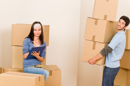 Removal team managing furniture transport in Kensington