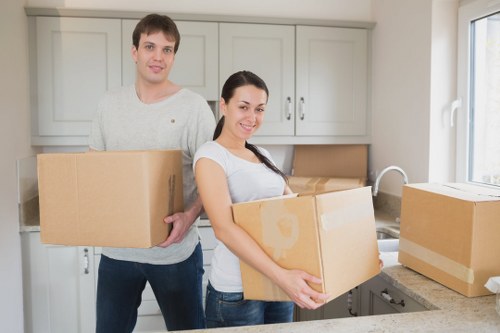 Professional movers handling boxes in Kensington